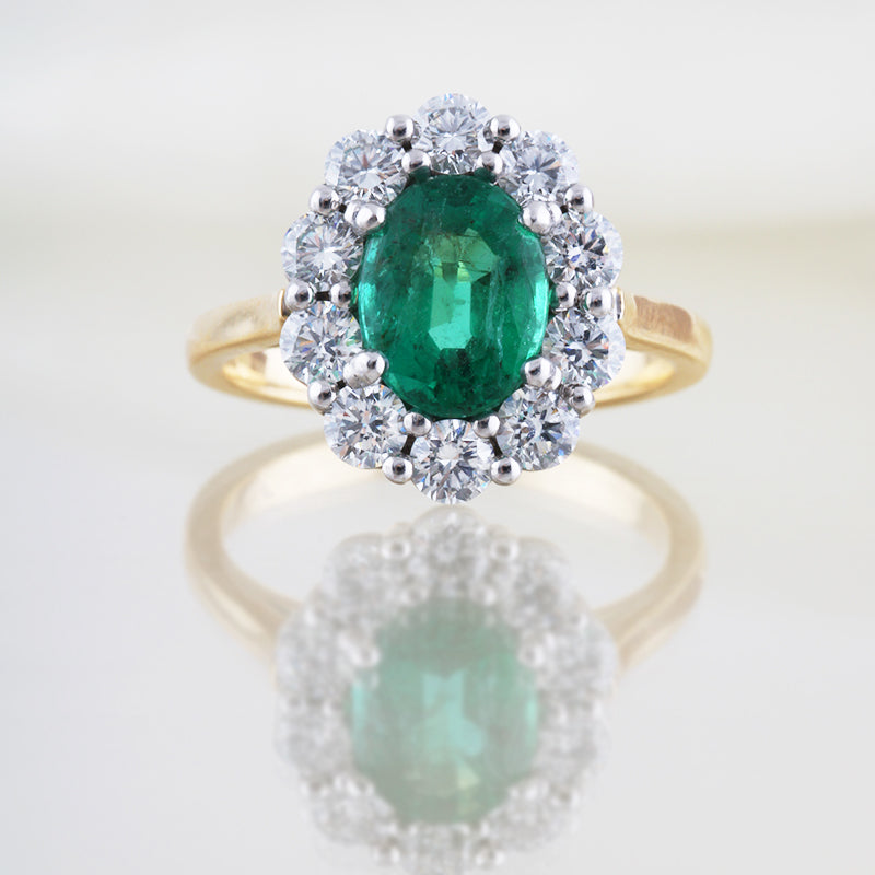 Oval Cut Emerald &amp; Diamond Cluster Ring