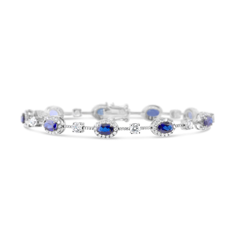 Oval Sapphire Halo & Round Cut Diamond Station Bracelet