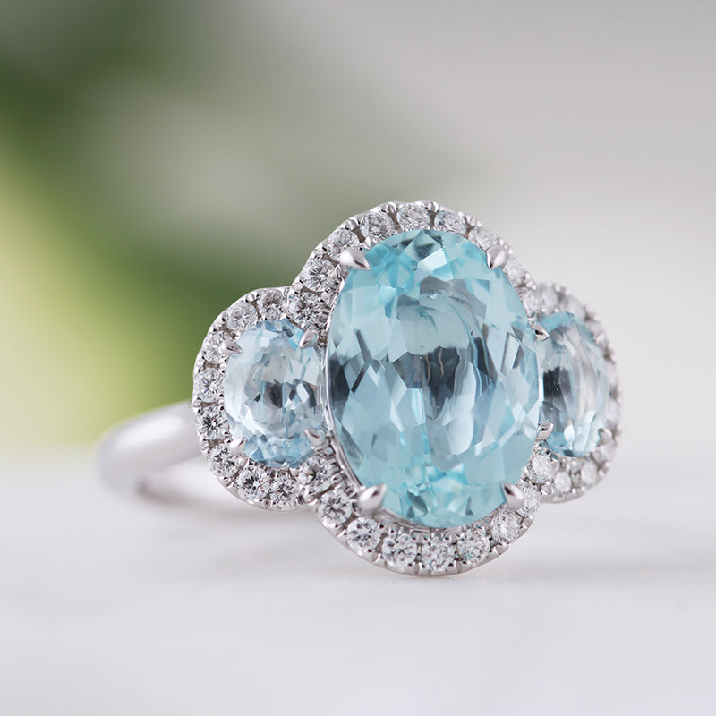 Oval Aquamarine &amp; Diamond Three Stone Halo Ring